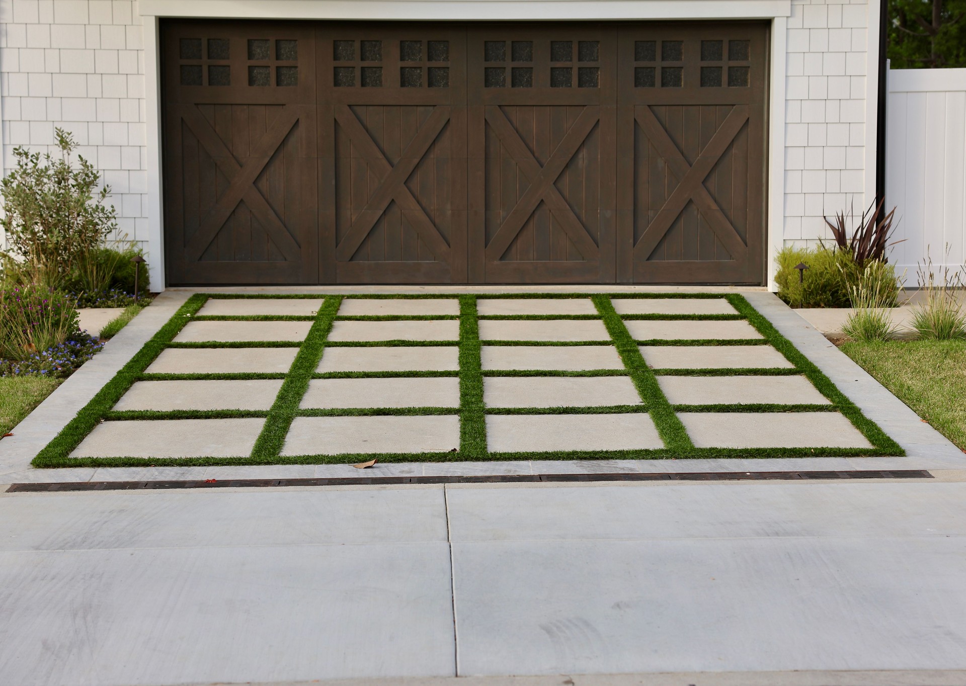 Farmhouse style garage door with decorative driveway